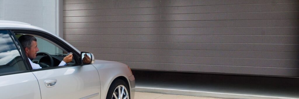 Opening garage door with remote from silver car